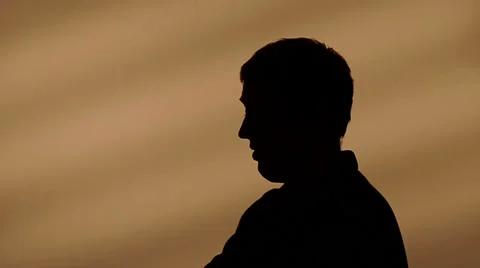 Male silhouette talking [Long Version] Stock Footage 32256986