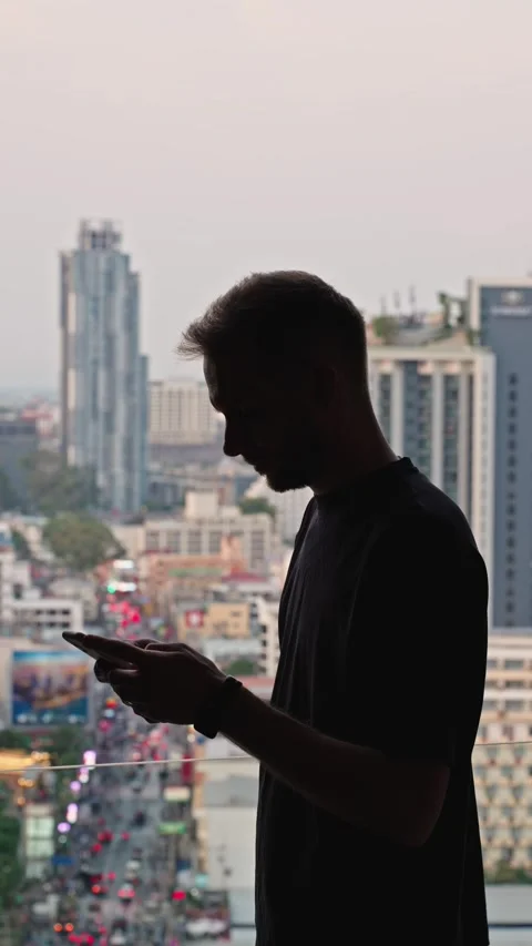 Male Silhouette Using Smartphone, Man Typing Messages On Smartphone Stock Footage 345341312