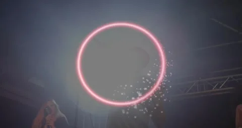 Male singer hitting high note causing pink neon ring swirling and backup singing 스톡 동영상 325966203