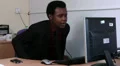 Male sitting at desk is bored and aching HD Footage