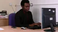 Male sitting at desk receives a sad message HD Footage