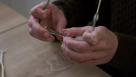 Male skilled hands working Close-up, eyeglass frames, emphasizing precision.. Video stock 293325880
