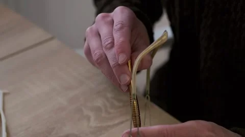 Male skilled hands working Close-up, eyeglass frames, emphasizing precision.. Video stock 294111632