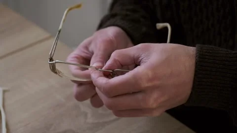 Male skilled hands working Close-up, eyeglass frames, emphasizing precision.. Video stock 327876302