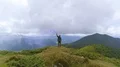 The male with a smoke bomb standing on a picturesque mountain 4k or 4k+ Resolution