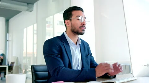 Male software developer coding software on a desktop computer in an office Stock Footage 201641018