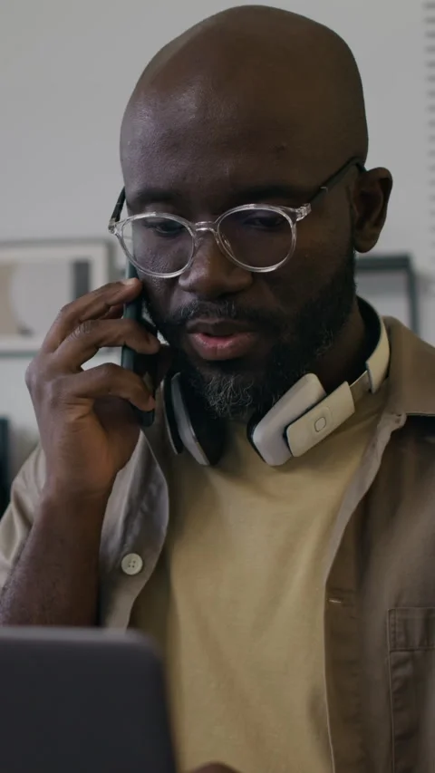 Male Software Developer Having Phone Conversation with Customer Stock Footage 299211013