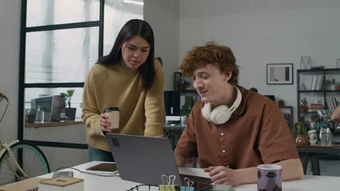 Male Software Developer Speaking with Young Female Coworker about Web Code Stock Footage 299233443