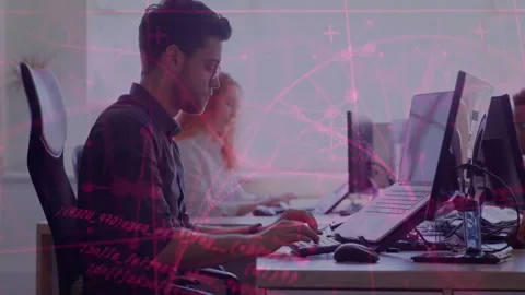 Male software developer typing on keyboard at open-plan tech office monitors Stock Footage 308658489