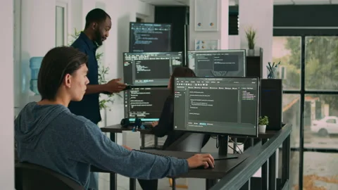 Male software developer typing machine learning app code on computer Stock Footage 217408760