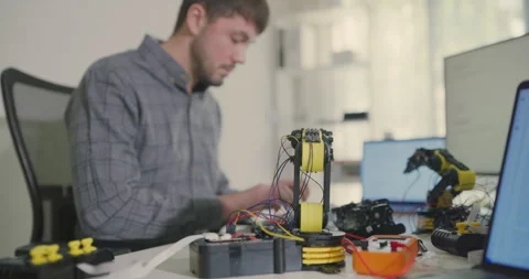 Male Software Developer Working on Desktop in Bright Modern Office. Stock Footage 306740021