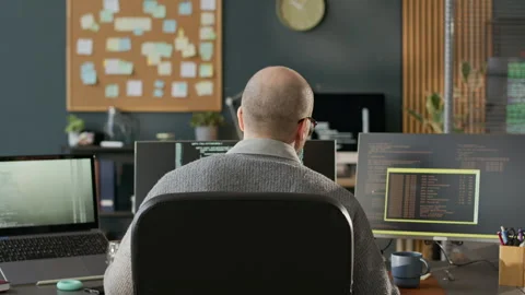Male Software Developer Working in Empty Programmers Office Stock Footage 306835202