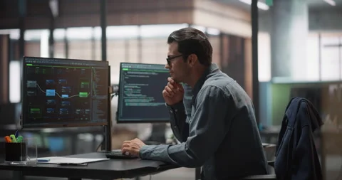 Male Software Developer Working in Office Stock Footage 321011766