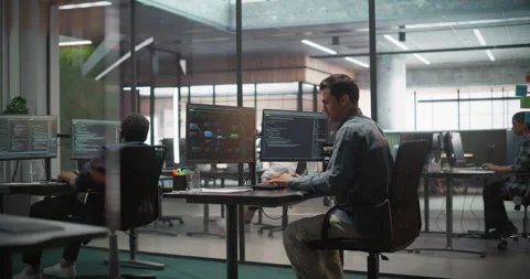 Male Software Developer Working in Office Stock Footage 321011857