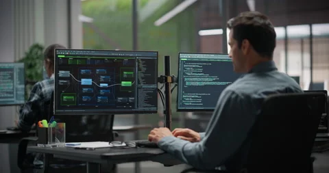 Male Software Developer Working in Office Stock Footage 321011874