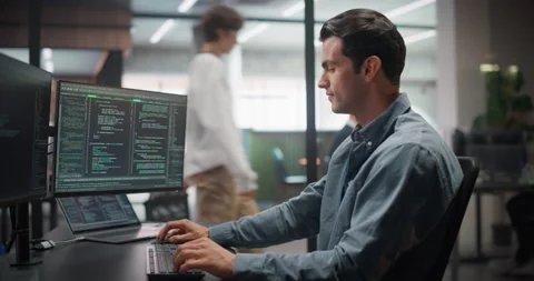 Male Software Developer Working in Office Stock Footage 321012129