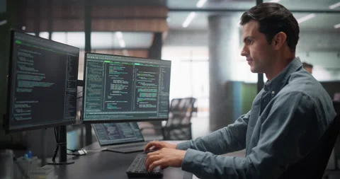 Male Software Developer Working in Office Stock Footage 321012154