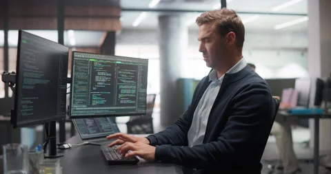 Male Software Developer Working in Office Stock Footage 321012196