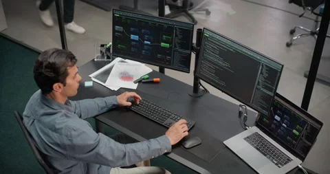 Male Software Developer Working in Office Stock Footage 321012394