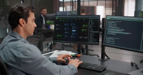 Male Software Developer Working in Office Stock Footage 321012490