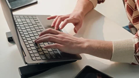 Male Software Developer Writing Code on Laptop Computer at Office Desk Video stock 330125284