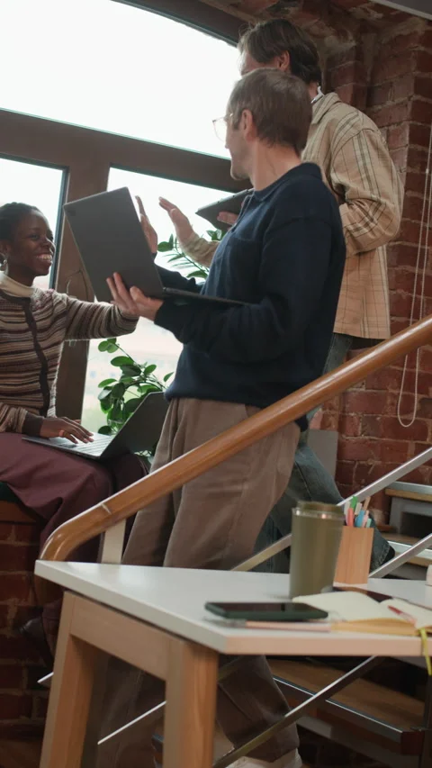 Male Software Developers Giving High Five to Black Female Colleague Downstairs Stock Footage 320002222