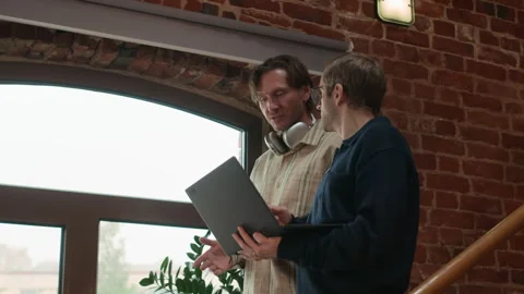 Male Software Developers Greeting Black Female Colleague Downstairs Stock Footage 320000928