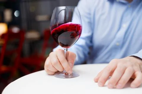 Male sommelier is checking and testing red wine Stock Photos