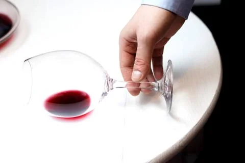 Male sommelier is checking and testing red wine Stock Photos