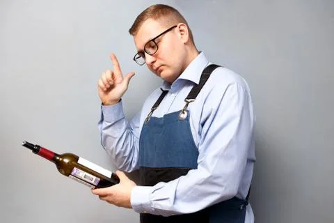 Male sommelier is checking and testing red wine Stock Photos
