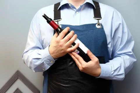 Male sommelier is checking and testing red wine Stock Photos