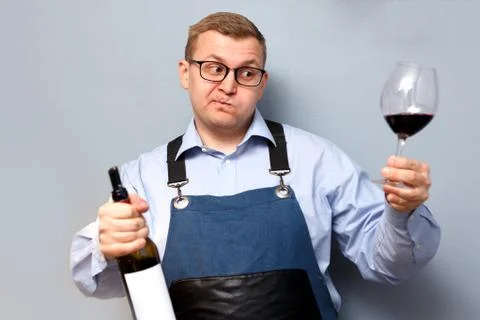 Male sommelier is checking and testing red wine Stock Photos
