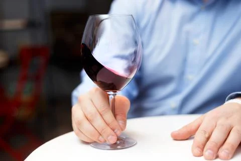 Male sommelier is checking and testing red wine Stock Photos