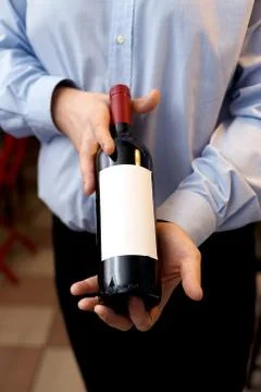 Male sommelier is checking and testing red wine Stock Photos
