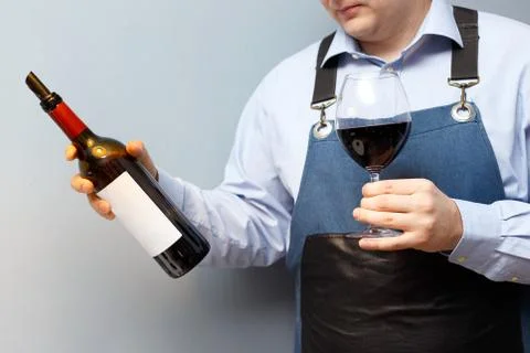 Male sommelier is checking and testing red wine Stock Photos