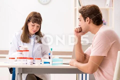 Male sperm donor visiting clinic Stock Photos