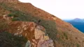 The male standing on the cliff with a picturesque landscape 4k or 4k+ Resolution