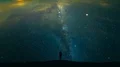 The male standing on a mountain on the starry sky background. time lapse 4k or 4k+ Resolution
