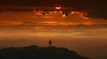 The male standing on a mountain top on a beautiful sunset background. time lapse 4k or 4k+ Resolution
