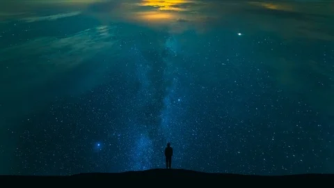 The male standing on the starry sky back... | Stock Video | Pond5