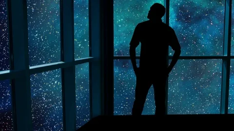 A male stands looking over an outer space scene in this futuristic concept. Stock Footage 112875294