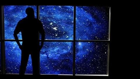 A male stands looking over an outer space scene in this futuristic concept. Stock Footage 112875441
