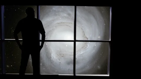 A male stands looking over an outer space scene in this futuristic concept. Stock Footage 112884063