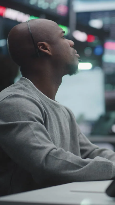 Male Stock Broker Analyzing Complex Trading Data at Multi Monitor Desk Stock Footage 330584970