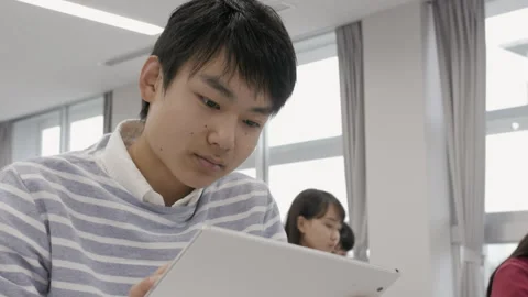 A Male Student Attending Class with a Tablet PC Stock Footage 333184650