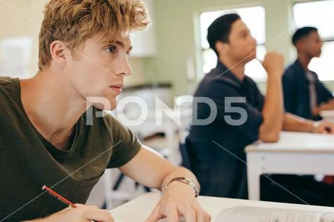 Male student in classroom Stock Photos