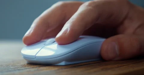 Male student click white computer mouse and scroll internet websites studying Stock-Footage 229865282