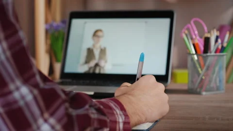 Male student doing homework lessons, learning online Stock Footage 130592484