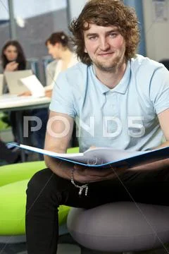 Male student with folder at college Stock Photos