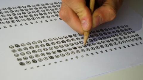 Male student hand testing doing examination test with anger. Standardized Stock Footage 121563944